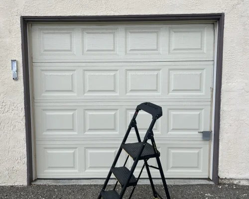 Garage Door Repair Huntington Beach 29 a ladder in front of a garage door